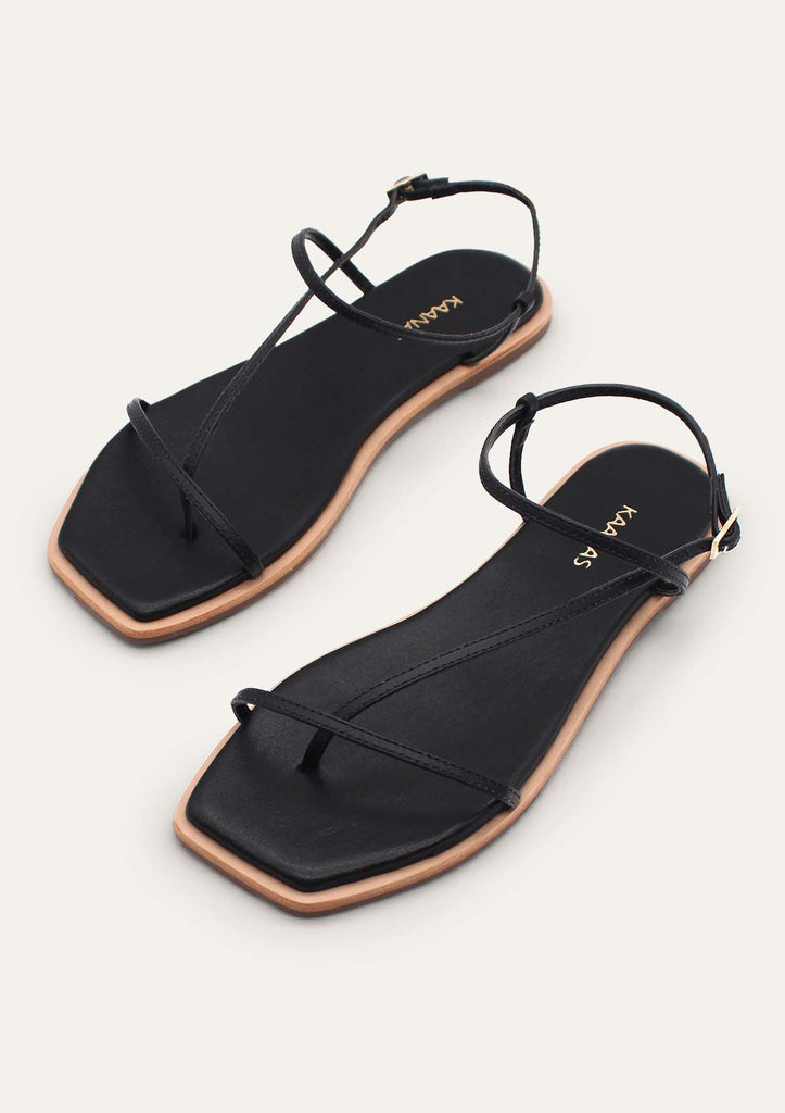 Saint Laurent Cassandra Leather Flat Sandals in Nero | FWRD